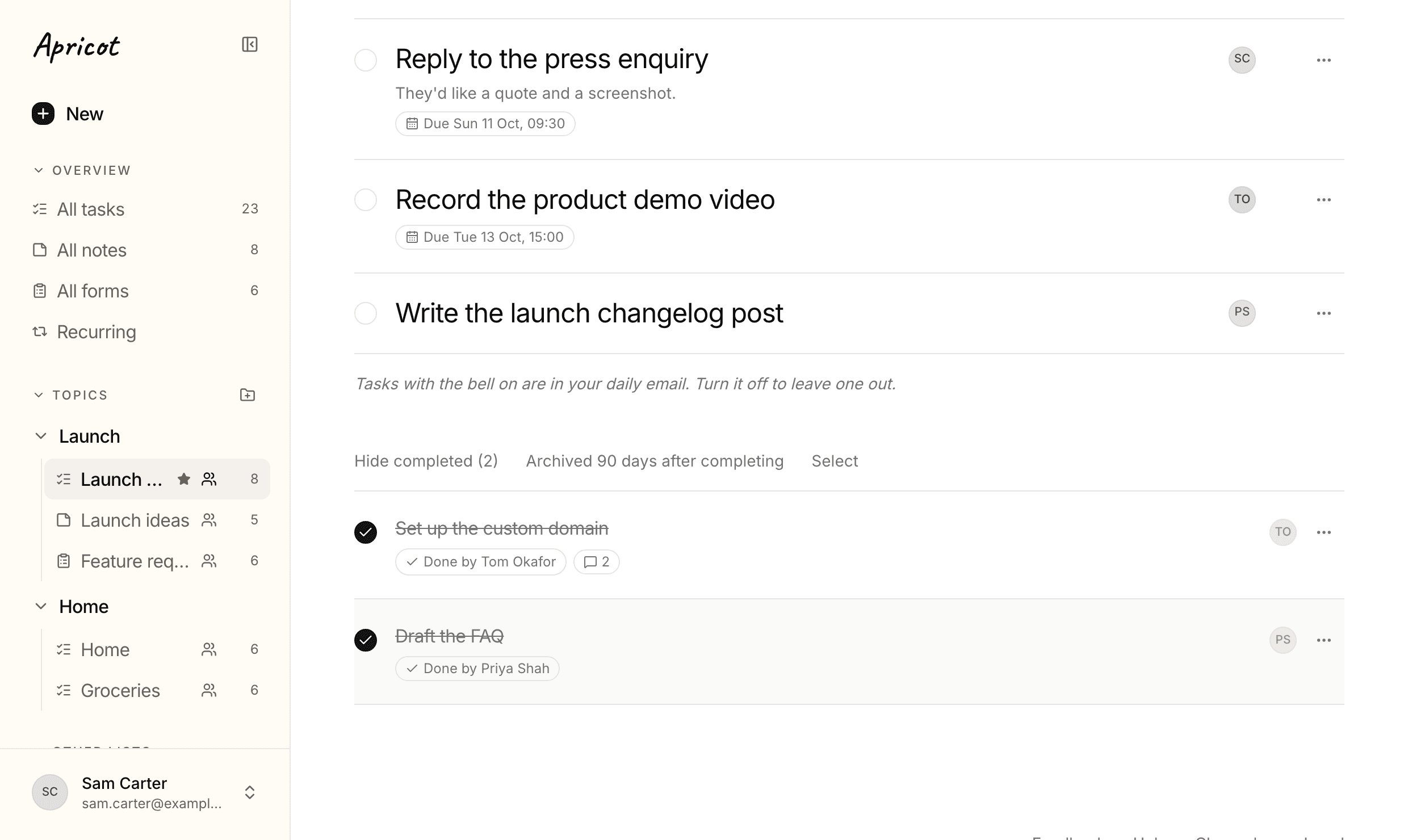 Launch plan with its completed tasks shown. Set up the custom domain is ticked off, with the tags Done by Tom Okafor and a speech bubble with 2; Draft the FAQ underneath says Done by Priya Shah.
